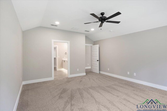 16226 Crossing Cir, Lindale, TX 75771 - unfurnished bedroom featuring baseboards, vaulted ceiling, and visible vents