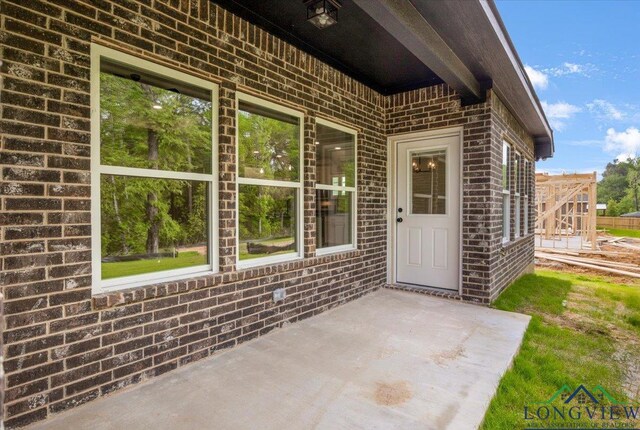 16226 Crossing Cir, Lindale, TX 75771 - entrance to property with brick siding and a patio area