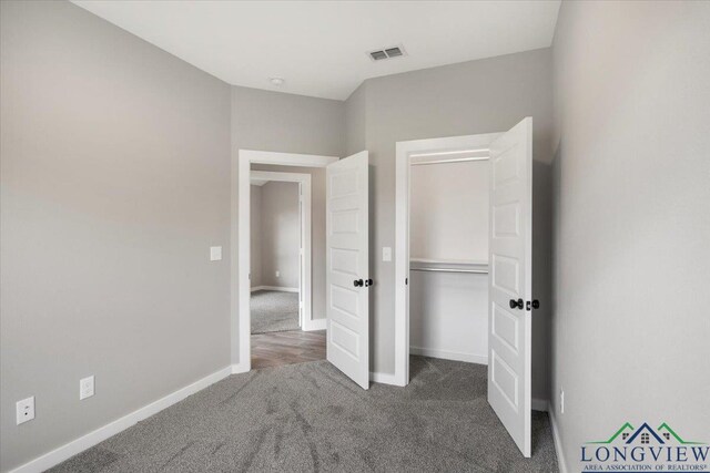 16226 Crossing Cir, Lindale, TX 75771 - unfurnished bedroom with carpet floors, baseboards, visible vents, and a closet