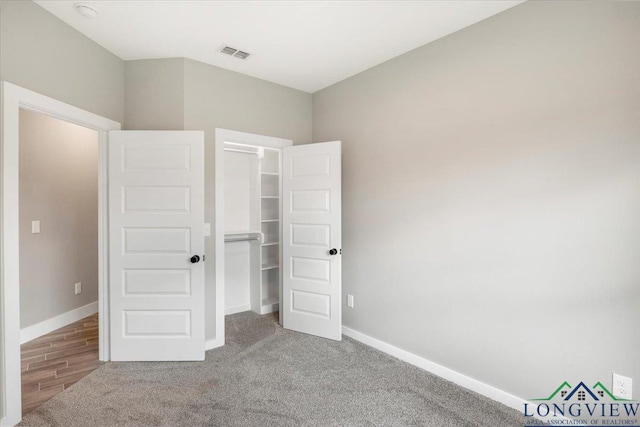 16226 Crossing Cir, Lindale, TX 75771 - unfurnished bedroom with baseboards, carpet, a spacious closet, and visible vents