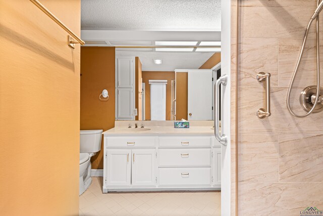 1208 Marigold Ln, Longview, TX 75604 - full bath featuring tiled shower, toilet, vanity, tile patterned flooring, and a textured ceiling