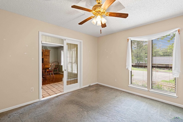 1208 Marigold Ln, Longview, TX 75604 - carpeted spare room featuring a textured ceiling, baseboards, and a ceiling fan