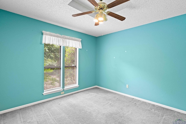 1208 Marigold Ln, Longview, TX 75604 - unfurnished room featuring carpet, a textured ceiling, ceiling fan, and baseboards