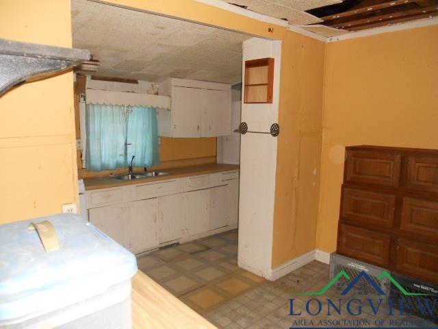 kitchen with white cabinetry and sink