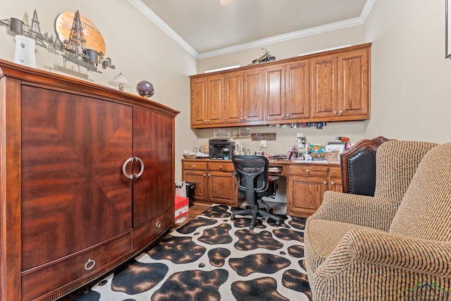 home office featuring built in desk and ornamental molding