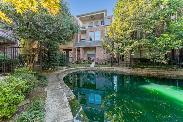 view of pool with ceiling fan