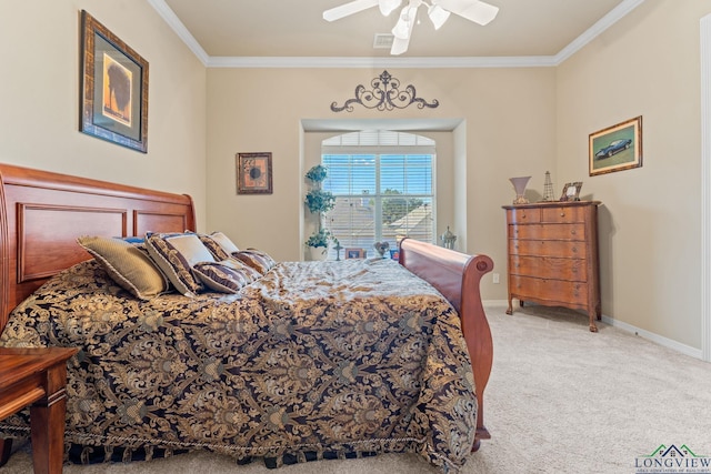 carpeted bedroom with ceiling fan and ornamental molding