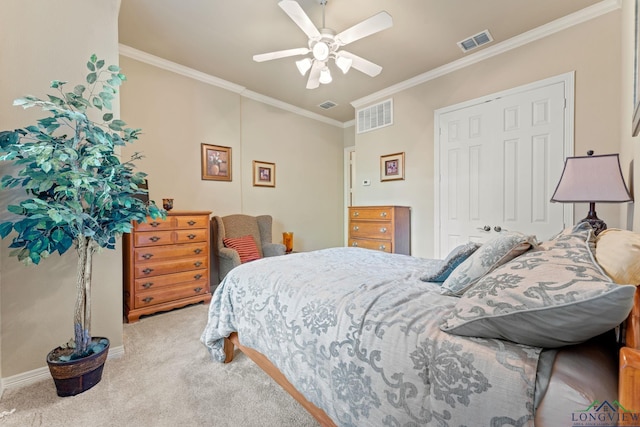 bedroom featuring ceiling fan, a closet, light colored carpet, and ornamental molding