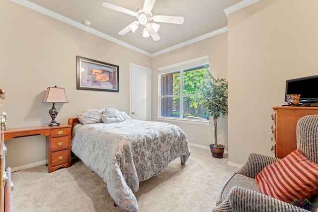 bedroom with light carpet, ceiling fan, and crown molding