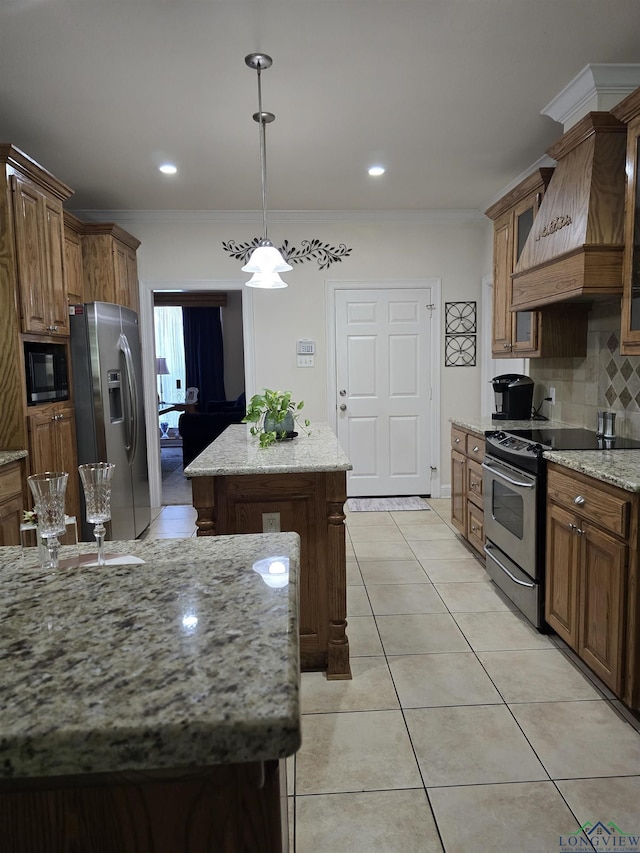 3720 Bill Owens Pkwy, Longview, TX 75605 - kitchen with stainless steel appliances, custom exhaust hood, a center island, ornamental molding, and tasteful backsplash