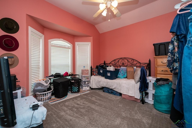 carpeted bedroom with lofted ceiling and ceiling fan