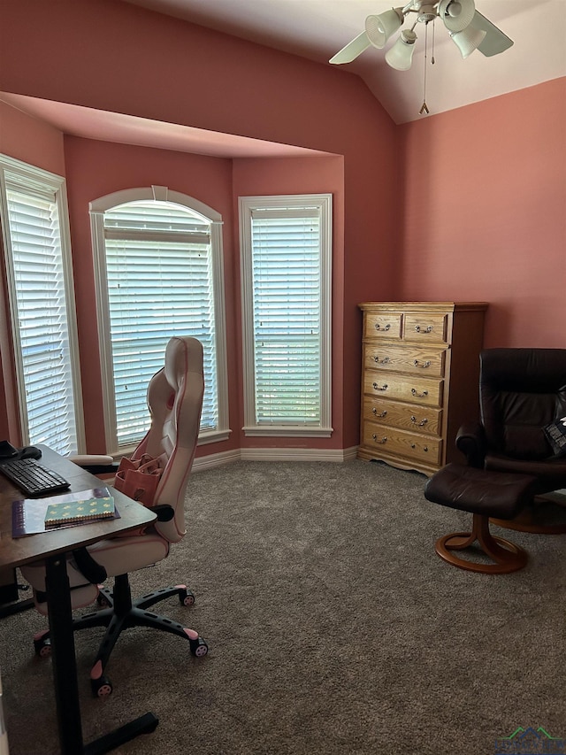 home office featuring ceiling fan, lofted ceiling, a healthy amount of sunlight, and carpet