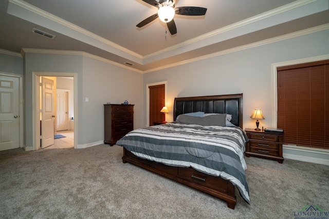 bedroom featuring ceiling fan, light colored carpet, ornamental molding, and a raised ceiling