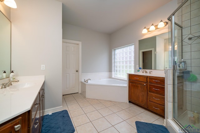 bathroom featuring tile patterned floors, independent shower and bath, and vanity