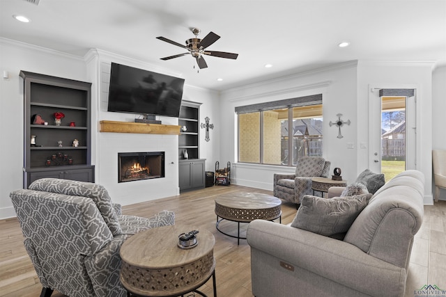 113 Saddle Brook Cir, Hallsville, TX 75650 - living area featuring ceiling fan, wood finished floors, a large fireplace, ornamental molding, and recessed lighting