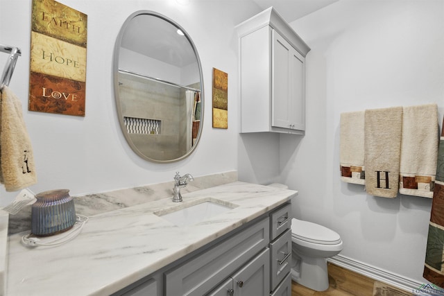 113 Saddle Brook Cir, Hallsville, TX 75650 - bathroom with vanity, wood finished floors, and a shower