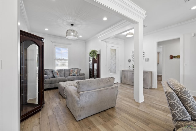 113 Saddle Brook Cir, Hallsville, TX 75650 - living room with crown molding, light wood-style flooring, and recessed lighting