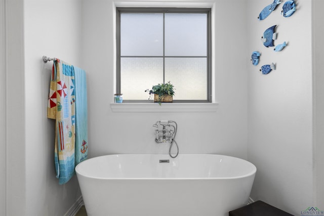 113 Saddle Brook Cir, Hallsville, TX 75650 - bathroom featuring a freestanding bath