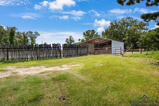 15136 Fm 852, Gilmer, TX 75644 - view of yard featuring an outdoor structure and an exterior structure