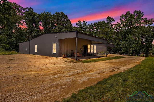 15136 Fm 852, Gilmer, TX 75644 - view of side of property with driveway and a carport