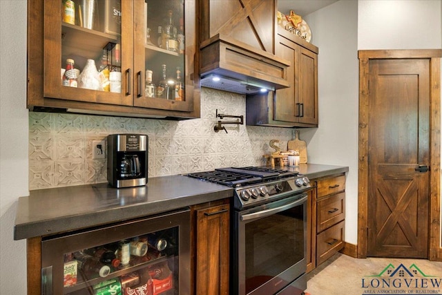 15136 Fm 852, Gilmer, TX 75644 - kitchen with gas stove, custom range hood, dark countertops, and decorative backsplash