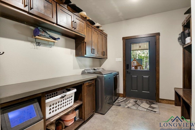 15136 Fm 852, Gilmer, TX 75644 - laundry room featuring washer and dryer and cabinet space