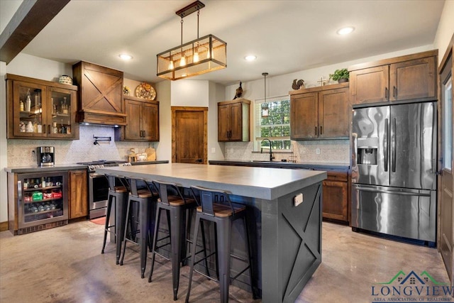 15136 Fm 852, Gilmer, TX 75644 - kitchen with stainless steel appliances, custom range hood, finished concrete floors, decorative backsplash, and recessed lighting