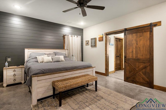 15136 Fm 852, Gilmer, TX 75644 - bedroom featuring a barn door, recessed lighting, a ceiling fan, and concrete flooring