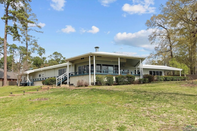 view of front of home with a front yard and a garage