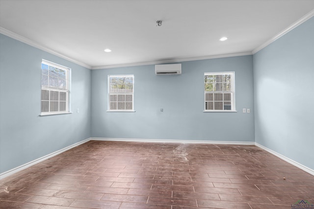 unfurnished room with an AC wall unit, a wealth of natural light, and crown molding