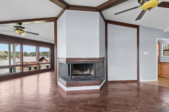 unfurnished living room with a multi sided fireplace, lofted ceiling with beams, and crown molding