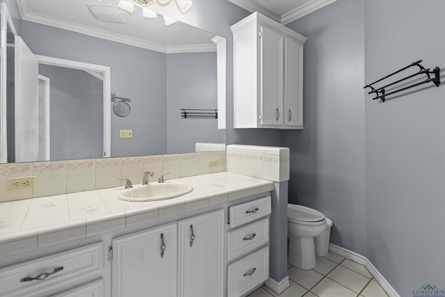 bathroom featuring tile patterned flooring, vanity, toilet, and crown molding