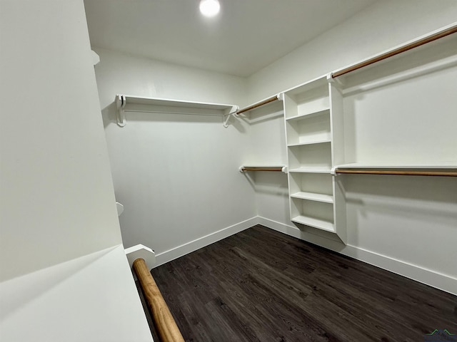 208 W Houston St, Daingerfield, TX 75638 - spacious closet with dark wood-style flooring