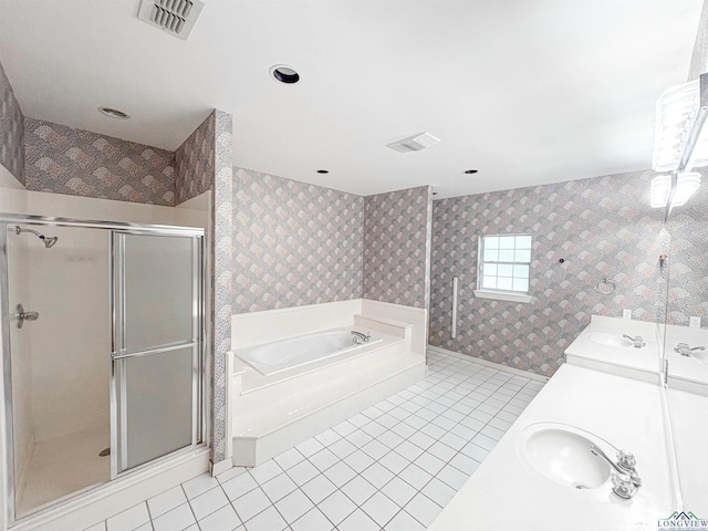 full bath featuring tile patterned floors, visible vents, wallpapered walls, and a sink