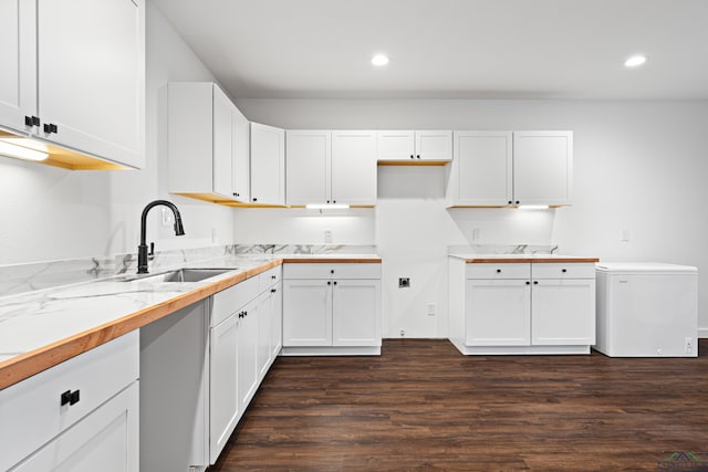 24016 Wildflower Cir, Lindale, TX 75771 - kitchen with a sink, fridge, dark wood-type flooring, recessed lighting, and white cabinetry