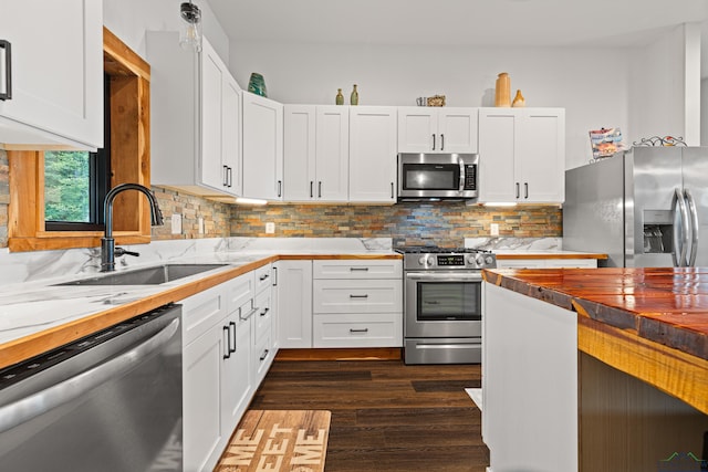 24016 Wildflower Cir, Lindale, TX 75771 - kitchen with appliances with stainless steel finishes, a sink, butcher block counters, and white cabinets