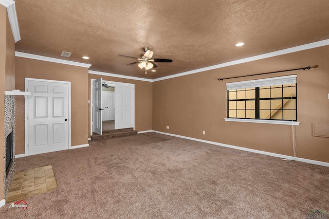 interior space with carpet, a brick fireplace, ceiling fan, ornamental molding, and a textured ceiling