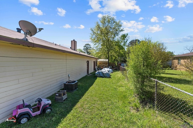 view of yard with central AC unit