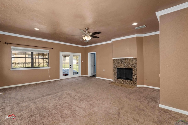 unfurnished living room with carpet flooring, french doors, ceiling fan, and ornamental molding