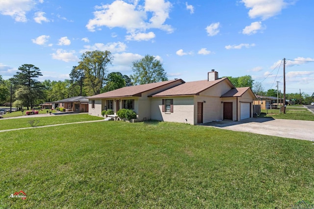 ranch-style home featuring a garage and a front yard