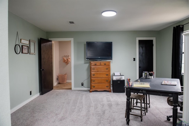 home office featuring light colored carpet