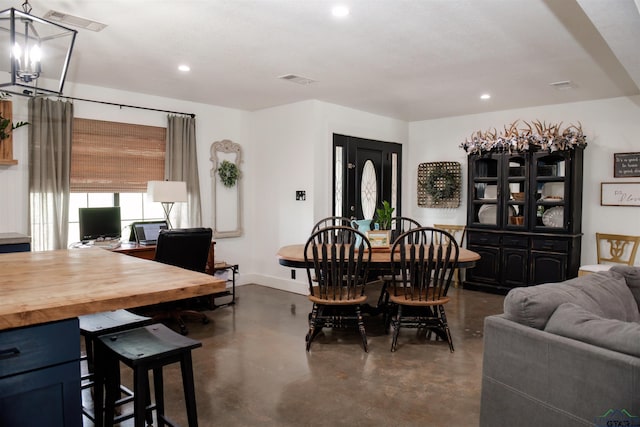 dining space with a notable chandelier