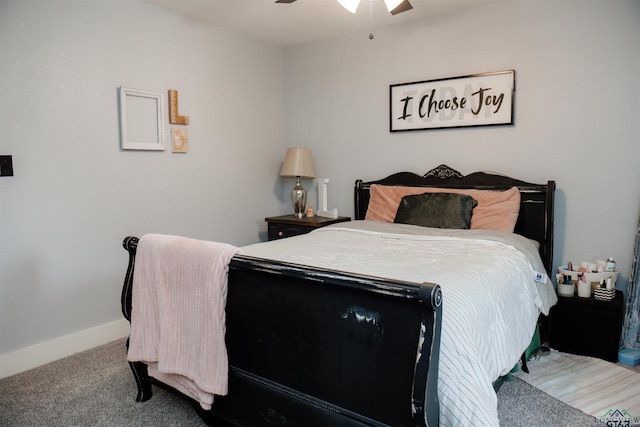 carpeted bedroom featuring ceiling fan