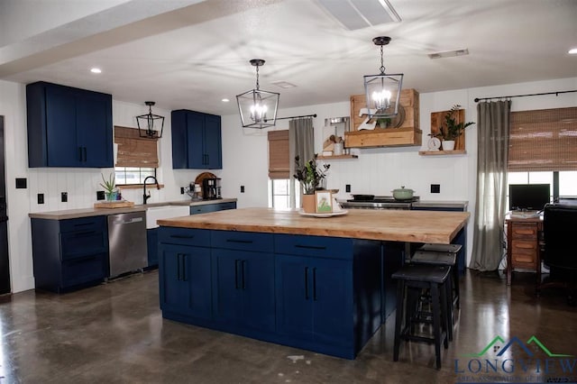 kitchen with blue cabinetry, dishwasher, a chandelier, a kitchen island, and butcher block counters