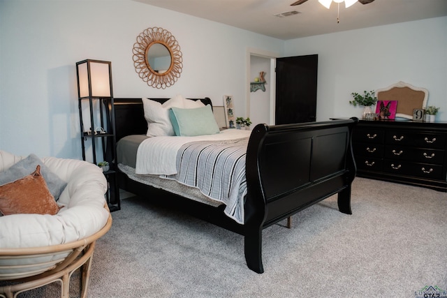 bedroom with ceiling fan and light colored carpet