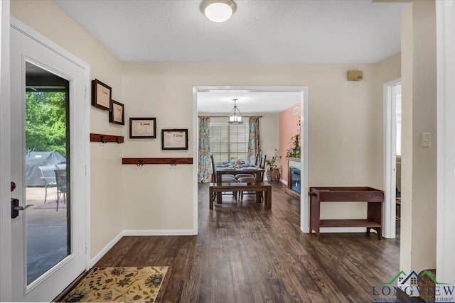 918 S Evenside St, Henderson, TX 75654 - entryway with healthy amount of natural light, dark wood-type flooring, and baseboards