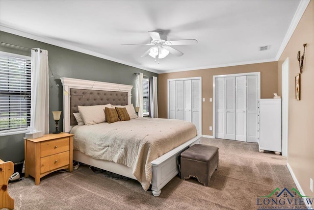 918 S Evenside St, Henderson, TX 75654 - bedroom featuring multiple windows, multiple closets, light carpet, crown molding, and a ceiling fan