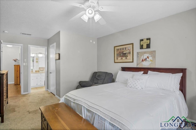 918 S Evenside St, Henderson, TX 75654 - bedroom featuring light colored carpet, baseboards, a ceiling fan, and ensuite bathroom