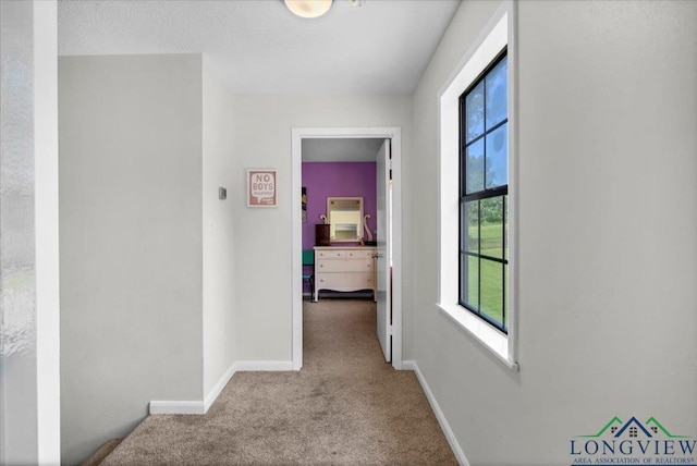 918 S Evenside St, Henderson, TX 75654 - hall featuring carpet, healthy amount of natural light, and baseboards