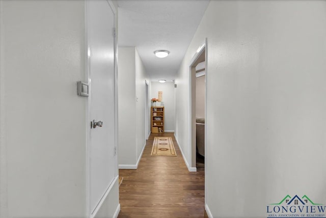 918 S Evenside St, Henderson, TX 75654 - corridor with wood finished floors and baseboards